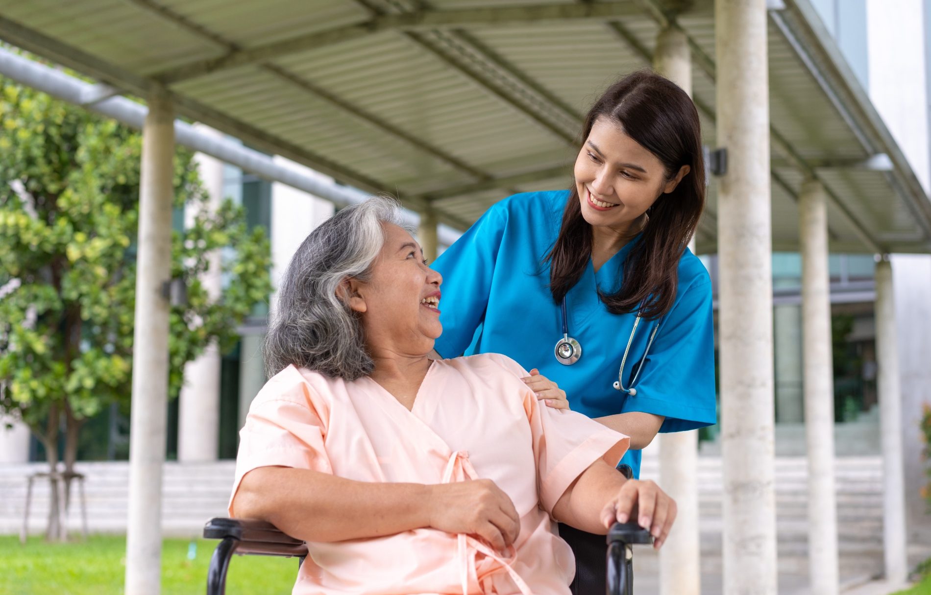 Professional caregiver providing bedridden patient care at home in Bangalore